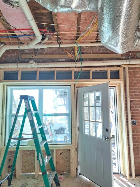 Before — attic window framing during interior remodeling in Sutton, MA