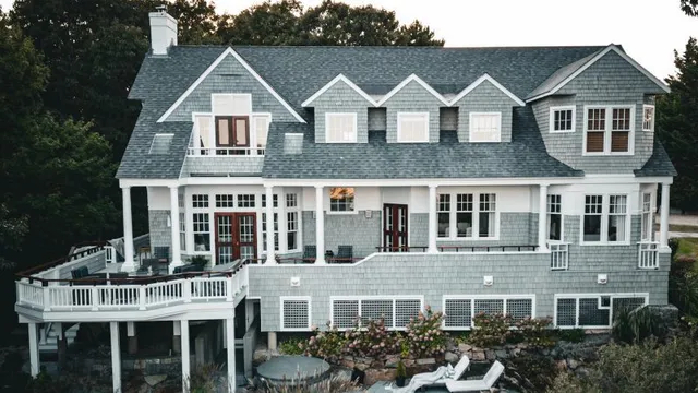 Professional painted home with grey siding and white trim