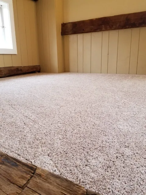 A carpeted loft in a renovated circa 1800’s barn in New Milford, CT.