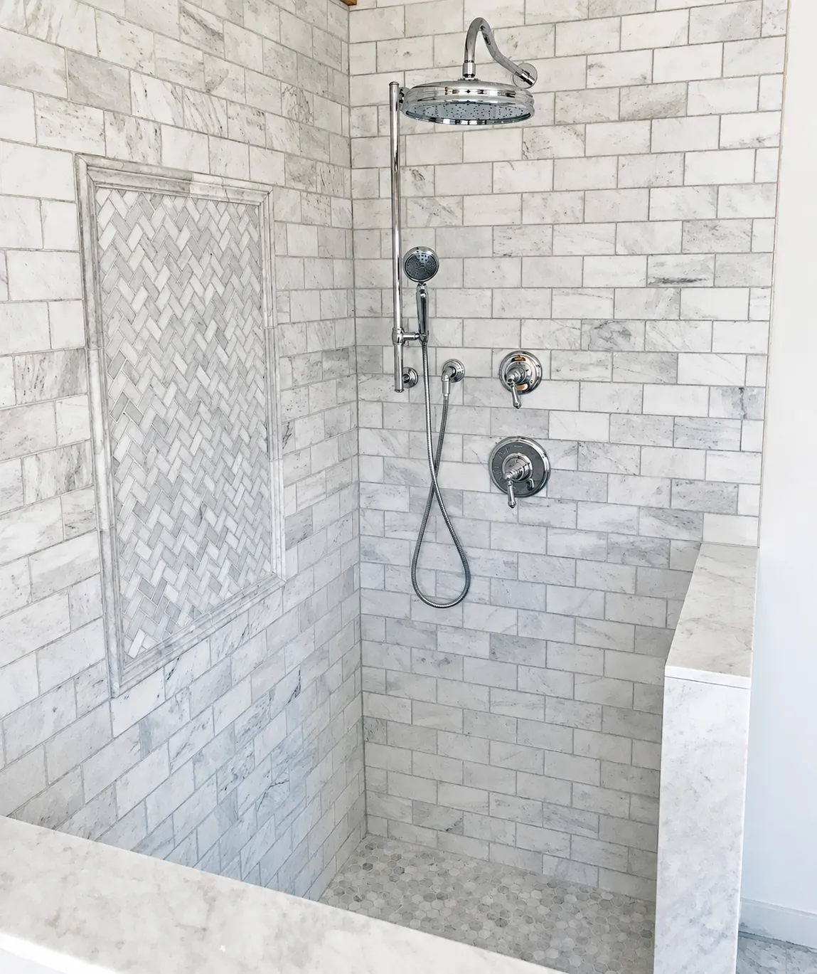 Bright marble shower and custom bathroom remodeling project by KBK Woodworking