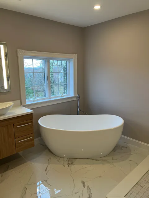 Freestanding Soaking Tub & Marble-Look Floor in Holliston, MA