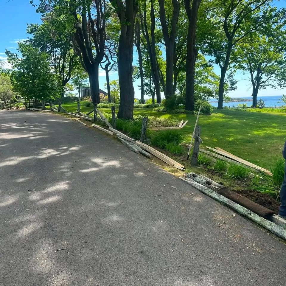 Old split-rail fence removed ahead of a replacement install