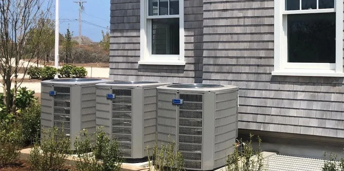 HVAC condenser units outside cape house
