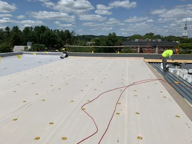 Rodd Roofing employees appling a Liquid-applied membrane roofing