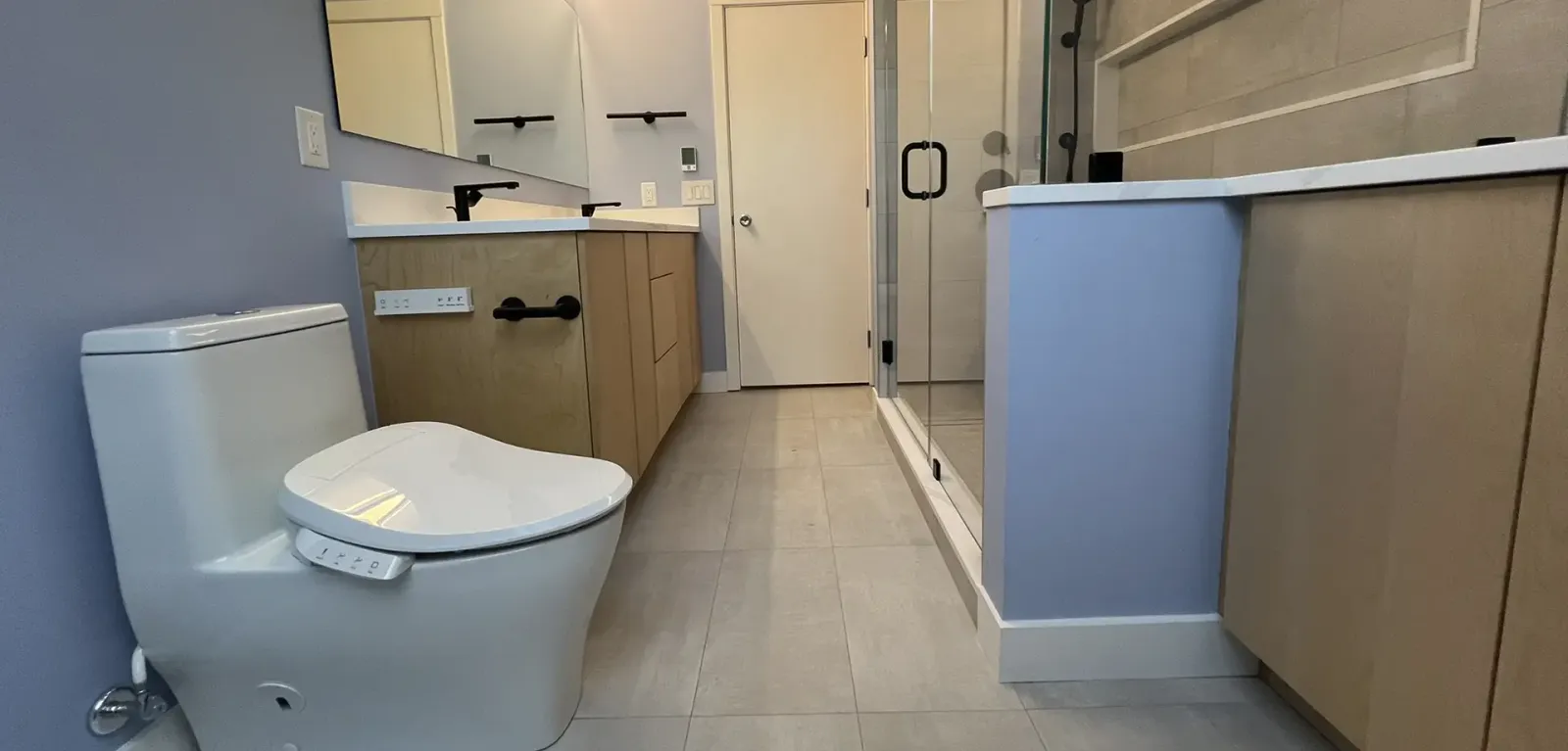 Remodeled bathroom with new vanity and tile work by Mr. Gomes Remodeling in Massachusetts