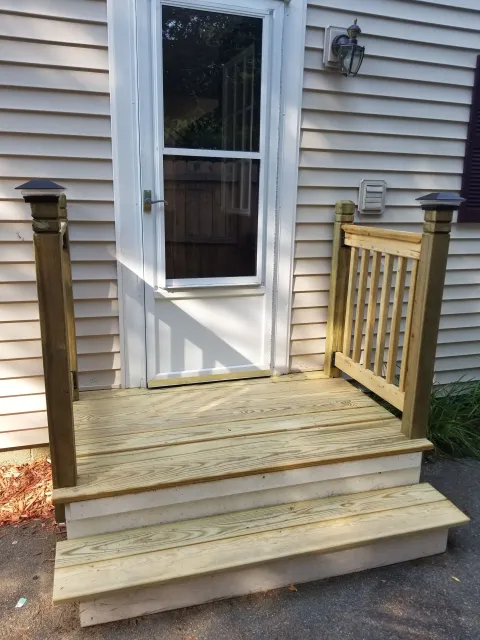 After, new side entrance deck/step looking beautiful with new wood, and side railings.