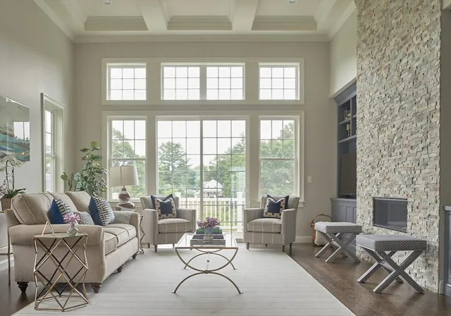 Family room with vaulted windows stone fireplace and built ins