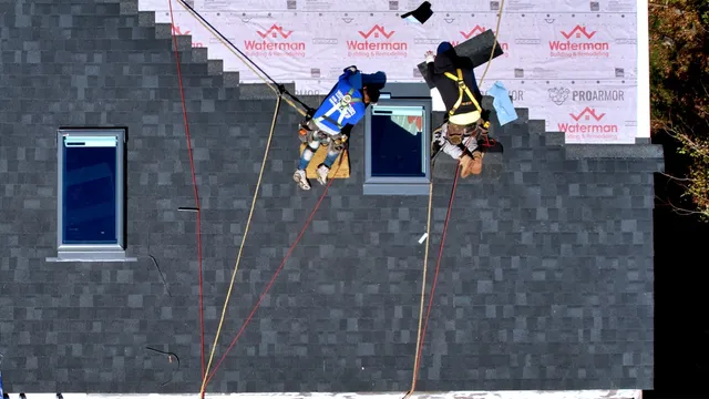 Waterman crew installing Velux skylights on a Massachusetts roof