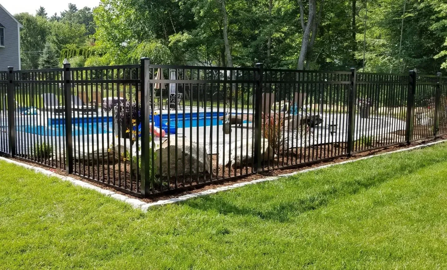 Poolside patio with fence in Rehoboth, MA