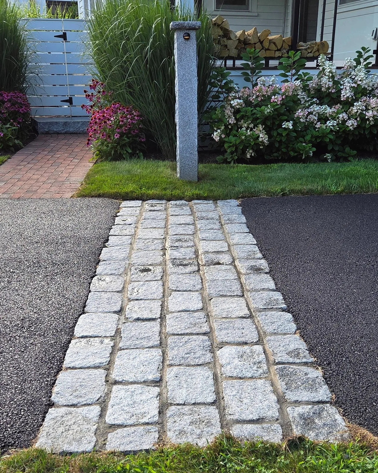 We love finishing touches like this recent project highlight!  A granite cobblestone apron adds character, defines the entrance, and creates a beautiful transition from the driveway to the walkway.  Sometimes it's these little details that make a big difference.

#LandscapeArchitecture #Cobblestone #CurbAppeal  #NewEnglandStyle #AngieVergeLandscapeDesign