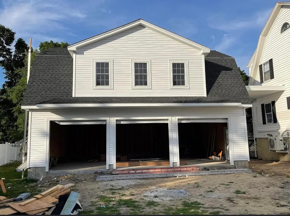 Custom three-bay garage addition completed by JTS Construction