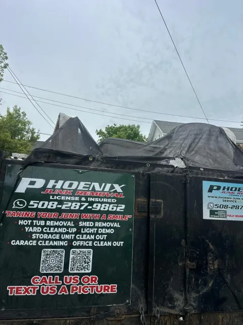 furniture movers Rhode Island carrying a sofa up stairs in Providence