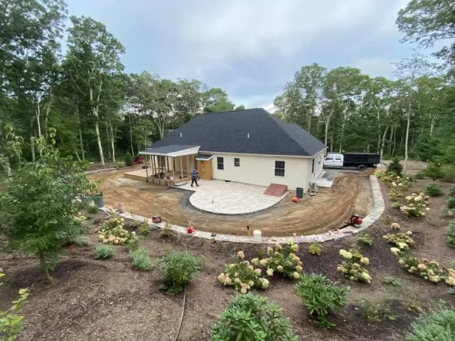 Elevated view of a rounded patio, walls and landscaping