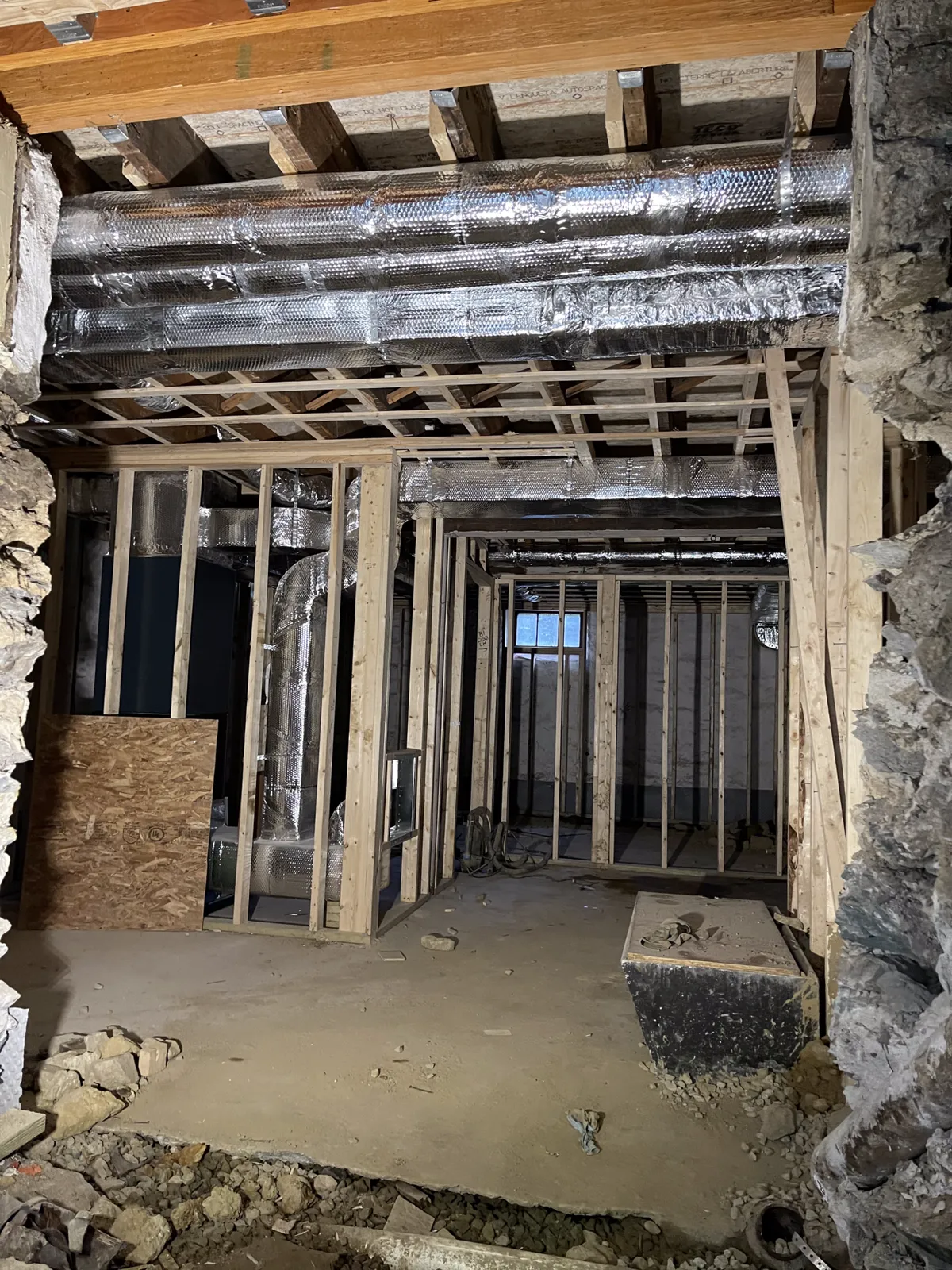Brookline renovation — all-new ductwork and heat pumps in a framed cavity