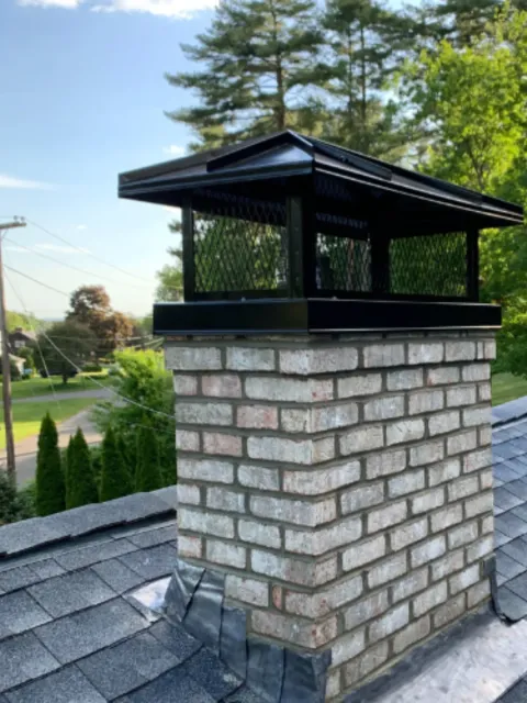 The Chimney Sweep Guys performing professional chimney cleaning and inspection in Essex Junction, VT