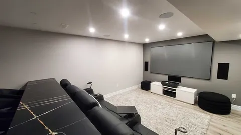 Finished basement with black sofa