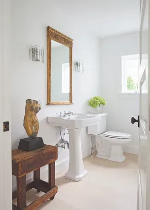 Powder bathroom with mixed metals
