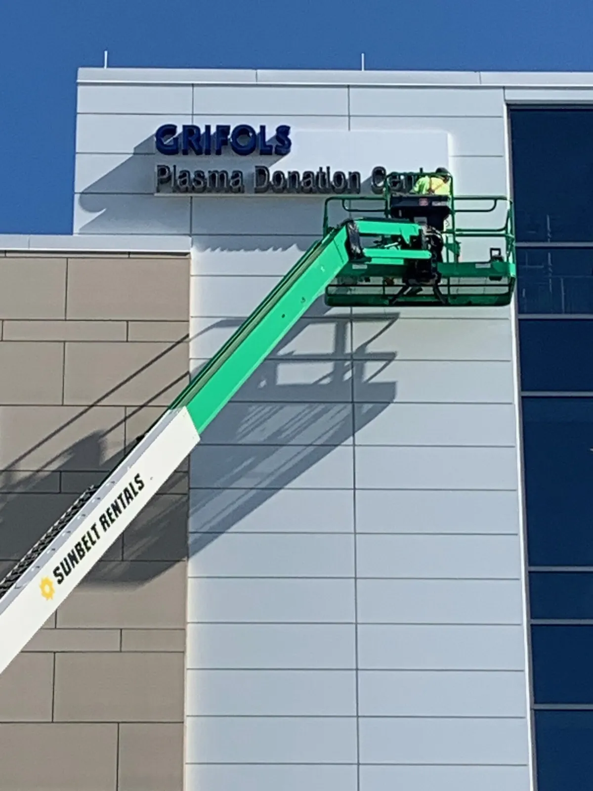 exterior commercial building paint job using crane