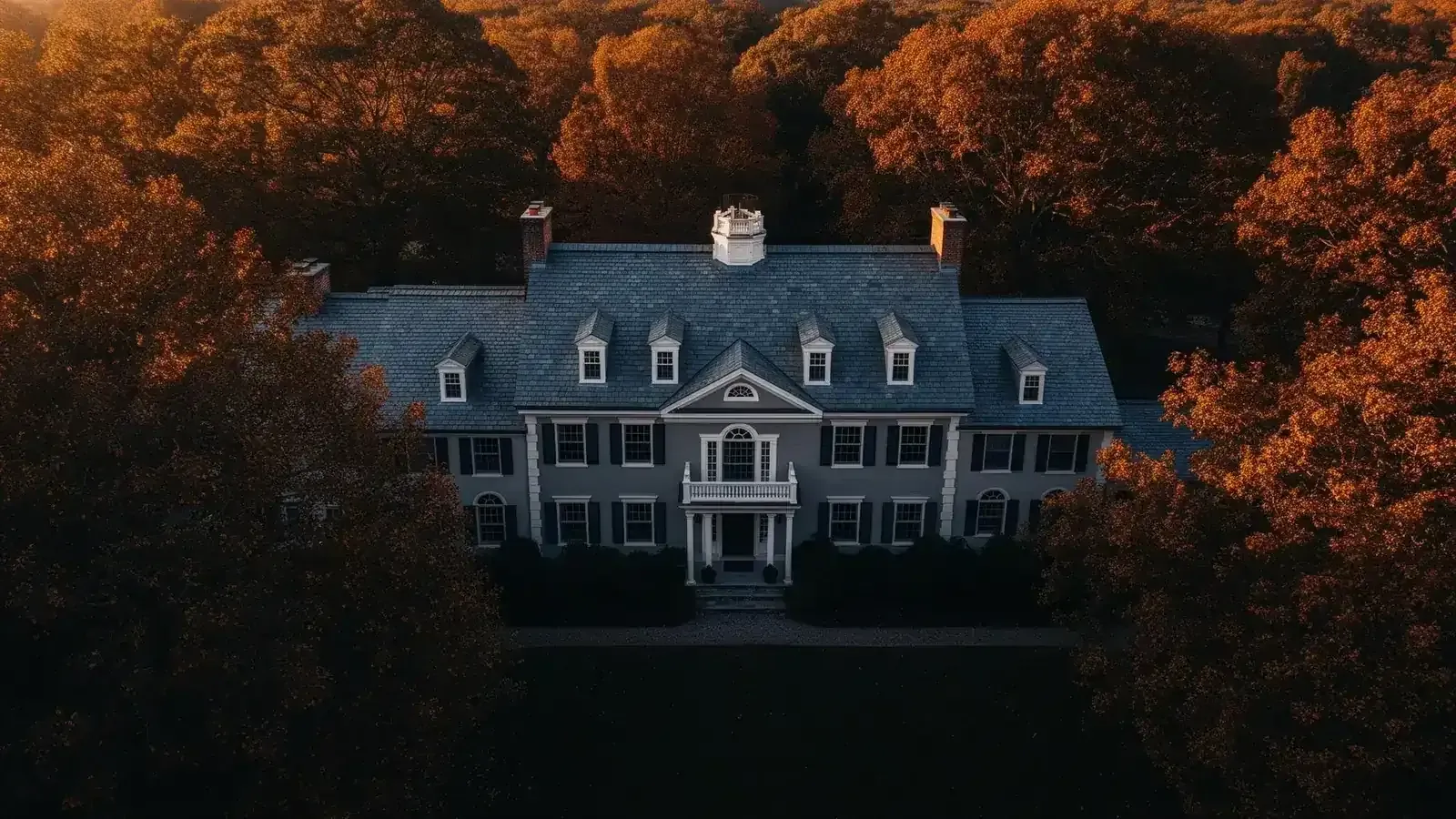 Aerial view of luxury colonial home with slate roof in Eastern Massachusetts