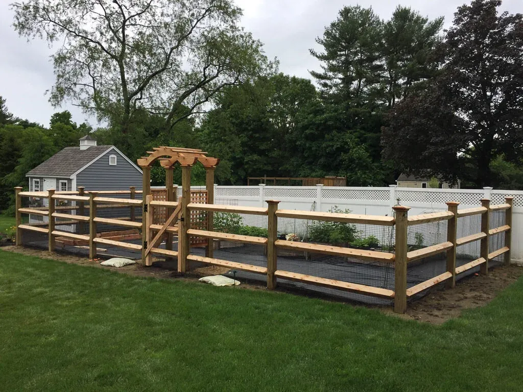 post and rail garden fence with arbor.jpg