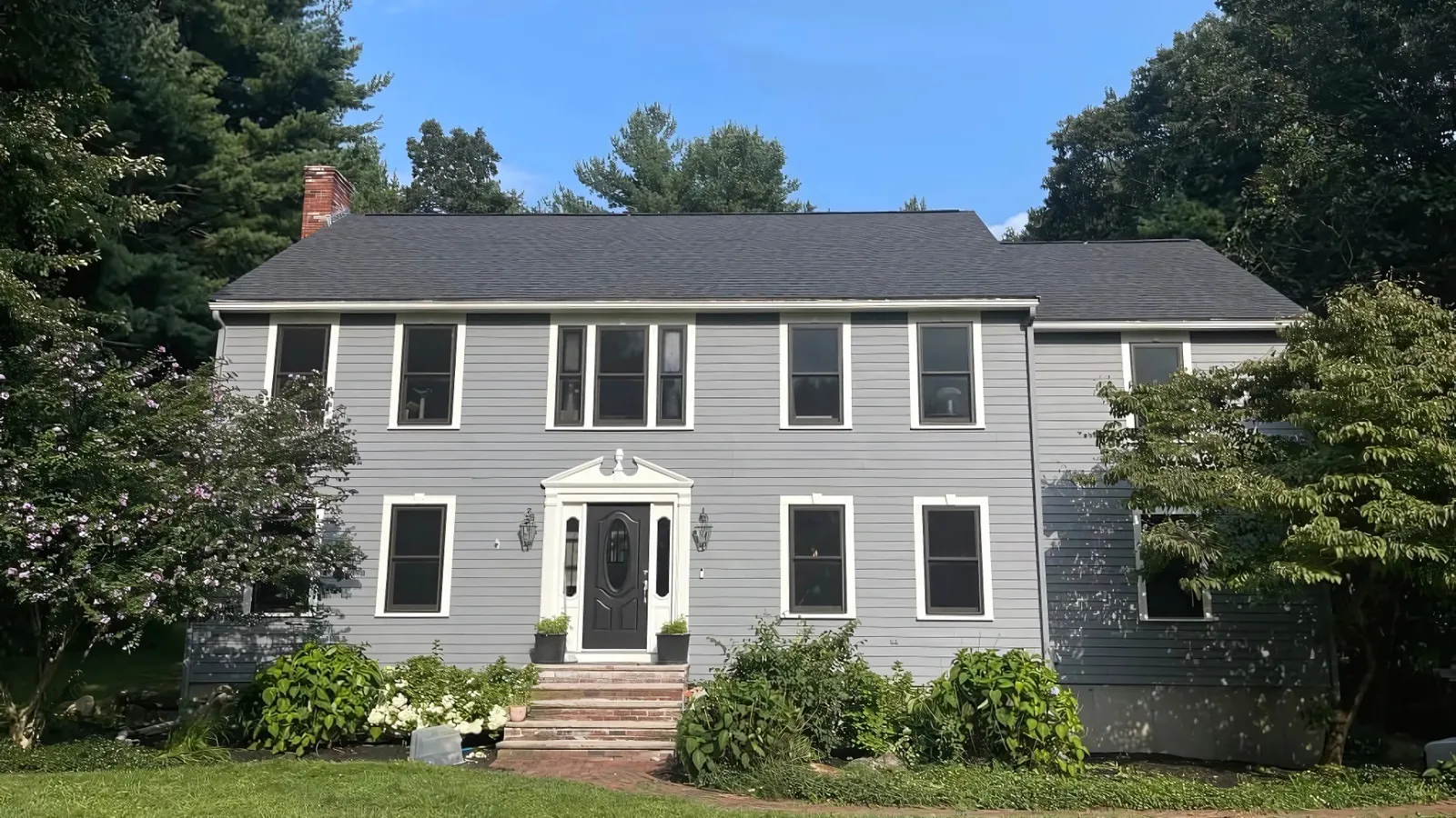 House with modern blue siding installed by D&G Exteriors in Malden, MA
