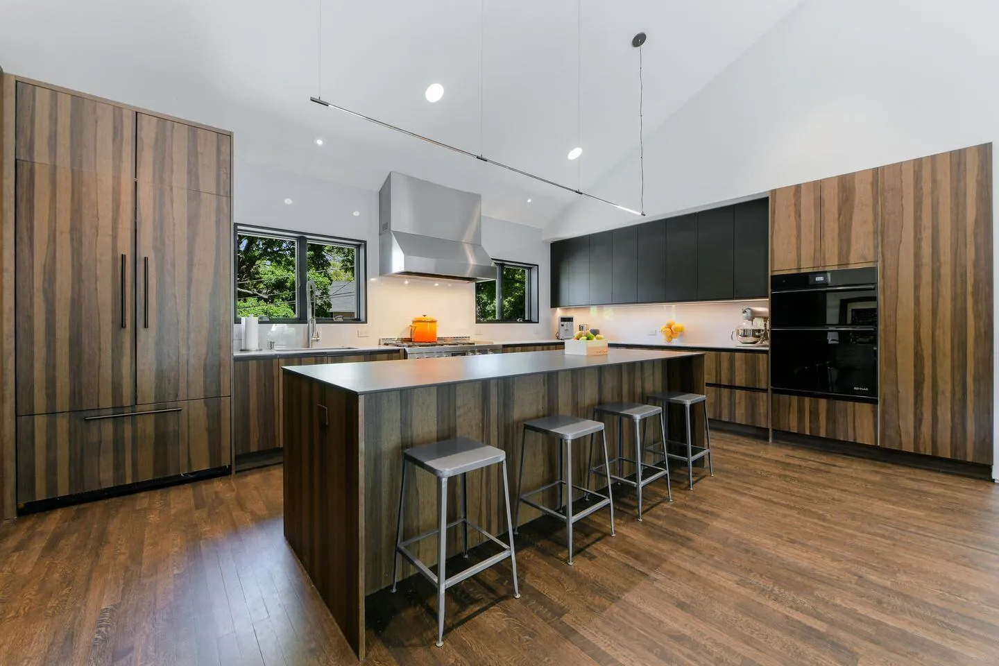 Walnut and black modern kitchen with island seating