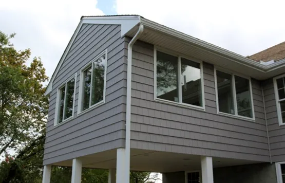 Elevated sunroom addition with wraparound windows