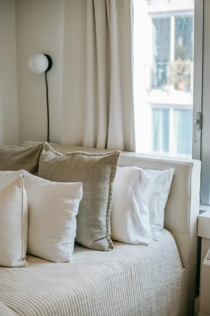 Luxurious bed cleaned by Maine house cleaning service
