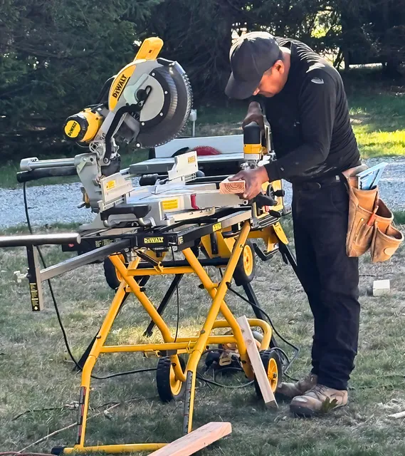 Our Worker Using a Drill