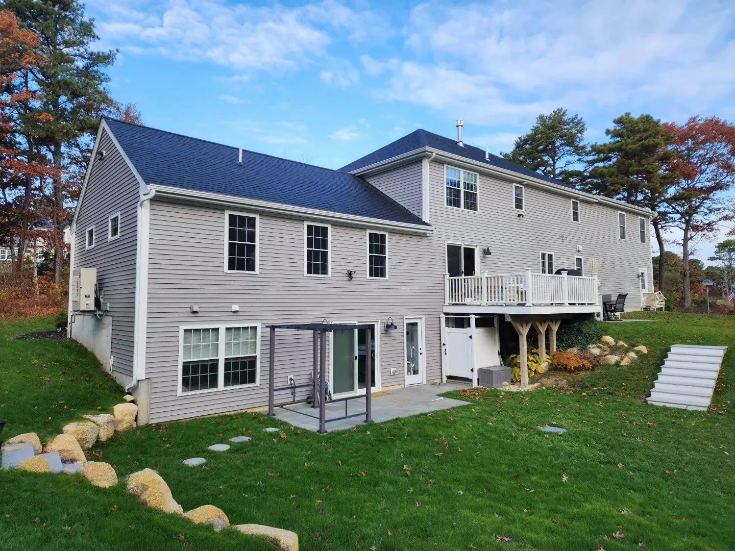 Home addition great room with inlaw suite and new deck stairs and railings Plymouth Ma by Freeland Woodworks.