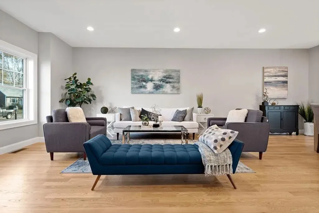 Bright living room with oversized windows in the Wakefield, MA renovation