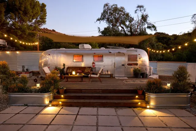 Airstream in the garden at dusk
