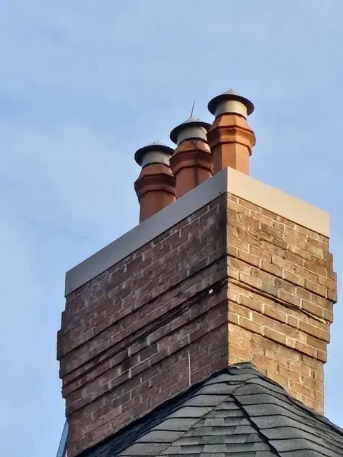 Brick chimney rebuild with new crown
